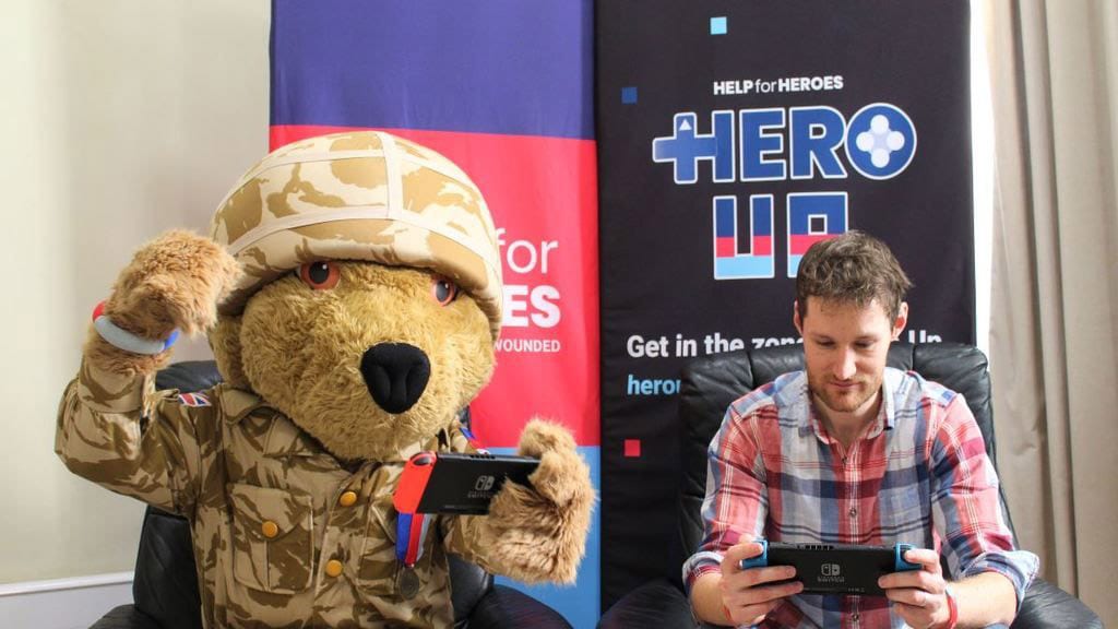 A teddy bear and a gamer playing together to raise money for Help for Heroes